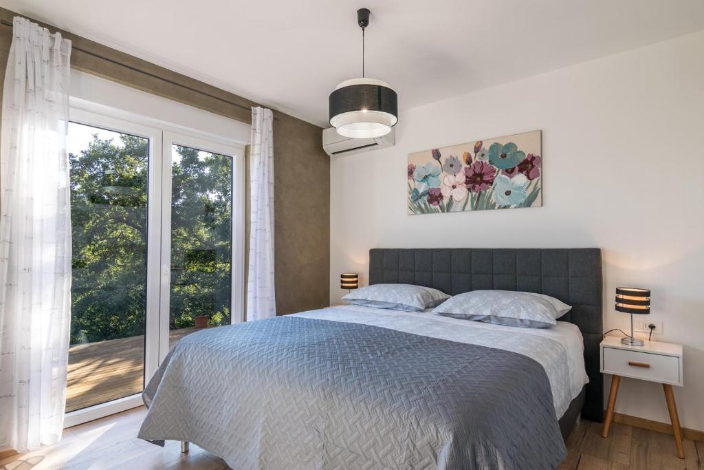 Postel nebo postele na pokoji v ubytování Villa Gloria