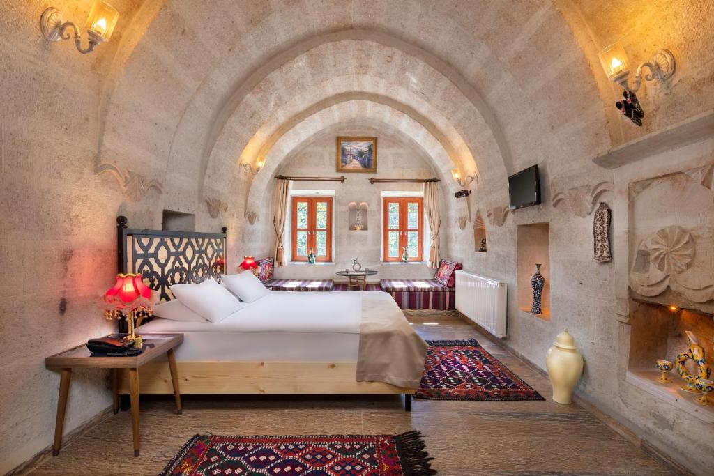 Postel nebo postele na pokoji v ubytování HacıAşık Konağı Butik Hotel