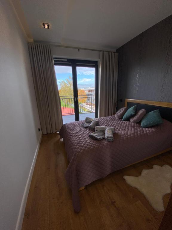 Posteľ alebo postele v izbe v ubytovaní OLIMPIC Apartament Klimatyzacja Garaż Winda Suwałki