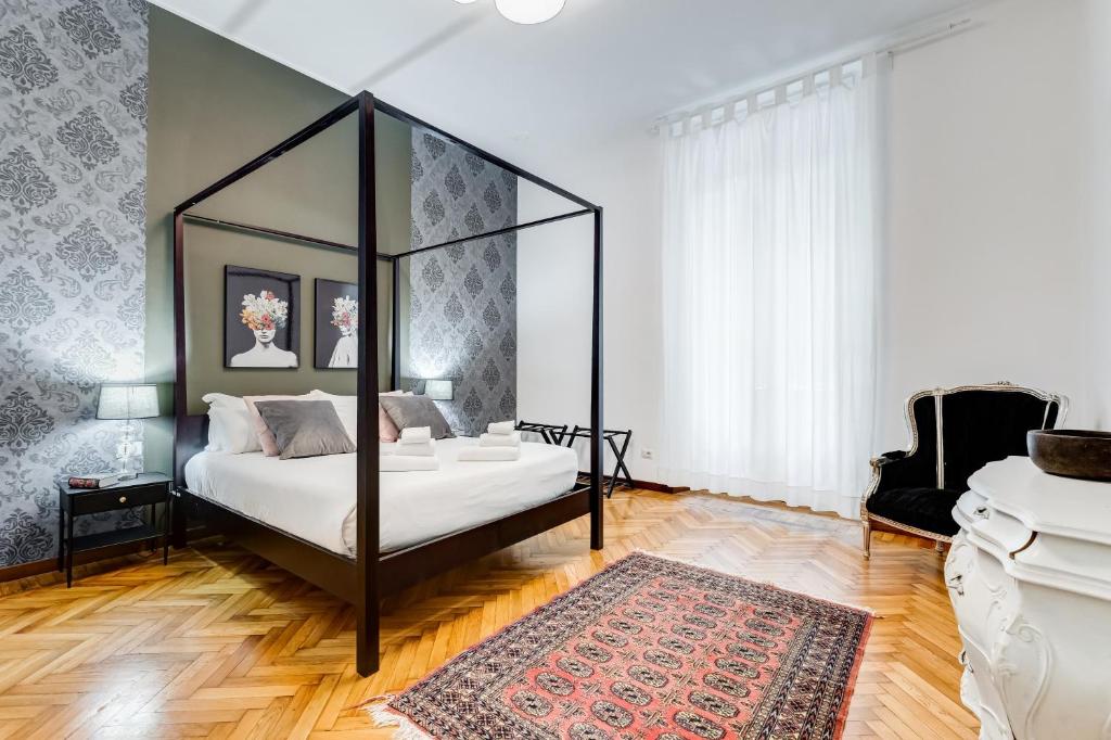 a bedroom with a bed and a rug at BDC - Residenza Valadier 3-Bdr and 3 bathrooms apt in Rome