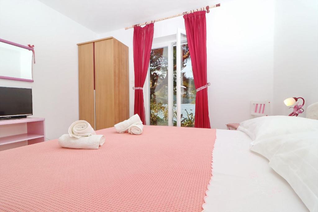 Postel nebo postele na pokoji v ubytování Apartments More & Ja