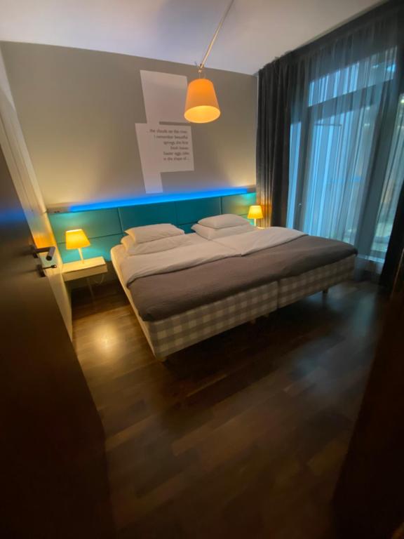 Postel nebo postele na pokoji v ubytování MOODs boutique hotel