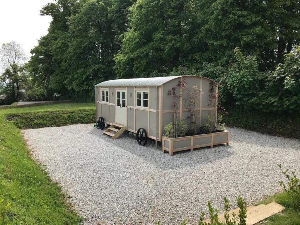 a tiny house sitting on gravel in a yard at Sage - UK36937 in Lamerton