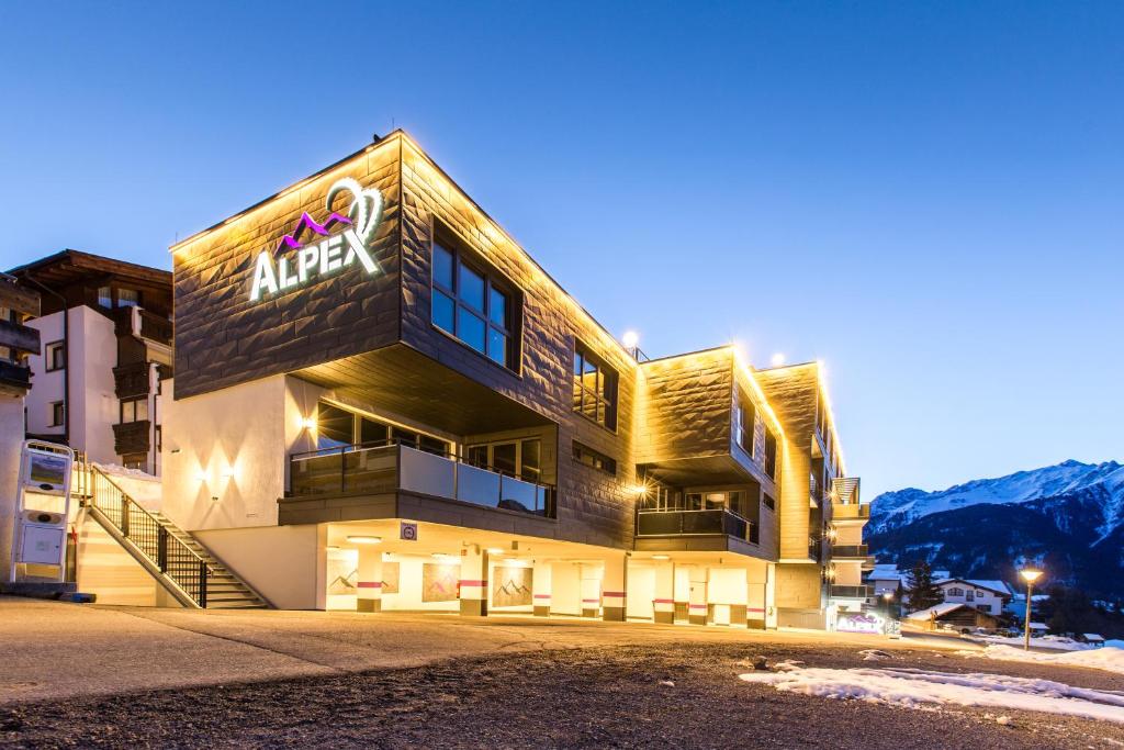 a building with a sign on the side of it at Alpex-Serfaus in Serfaus