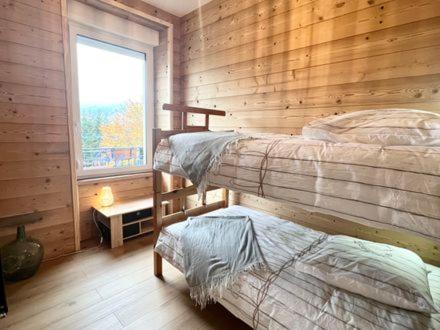 Posteľ alebo postele v izbe v ubytovaní L'apparté de G, Gîte 3 étoiles de montagne cosy