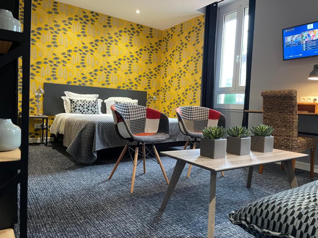 Postel nebo postele na pokoji v ubytování Le Nouvel Hôtel