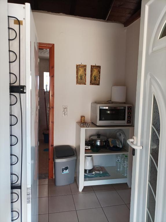 Kuchyň nebo kuchyňský kout v ubytování Villa Fraoulitsa