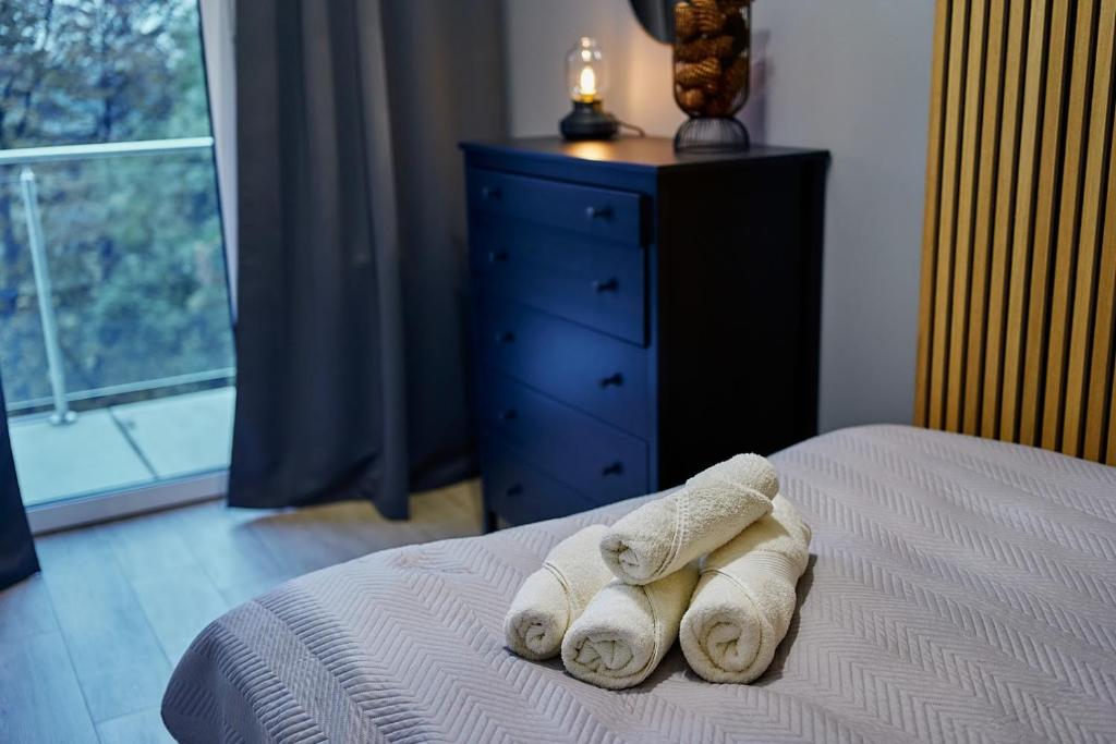 Posteľ alebo postele v izbe v ubytovaní LAGUNA Apartament Polanica Residence 57