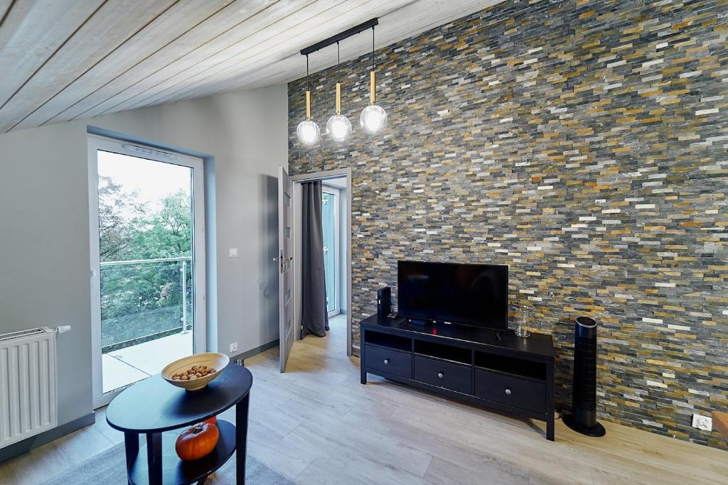 Televízia a/alebo spoločenská miestnosť v ubytovaní LAGUNA Apartament Polanica Residence 57