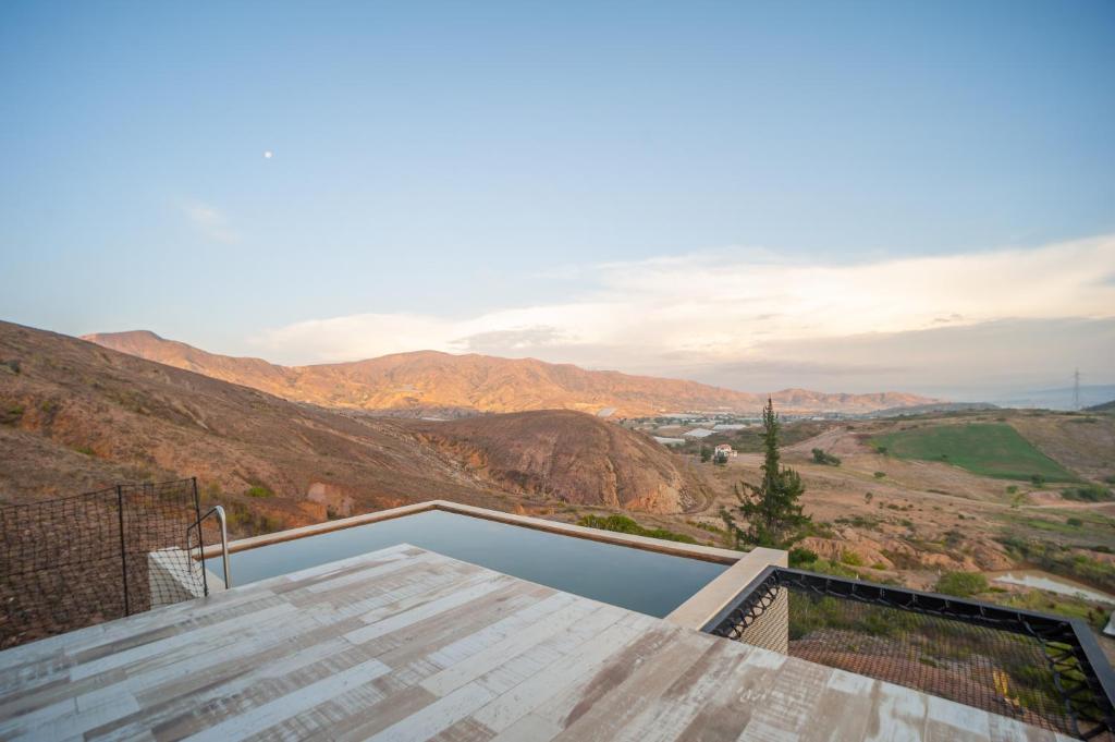 a view of the mountains from the roof of a house at Terrojo - Glampings de Lujo Duerme Bajo las Estrellas in Sáchica