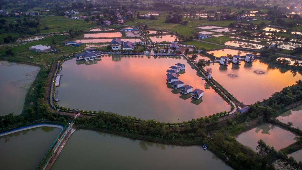 an aerial view of a resort with two large lakes at Lumbini Palace Resort in Lumbini