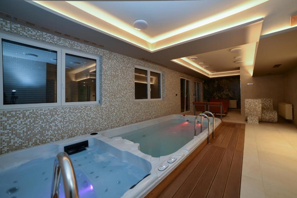 a large bathroom with a large bath tub at LAGUNA Apartament Polanica Residence 57 in Polanica-Zdrój