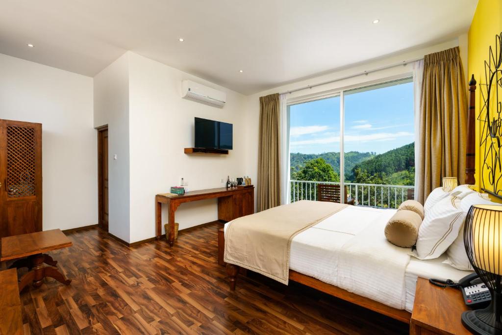 Postel nebo postele na pokoji v ubytování Morning Dew Boutique Hotel Ella