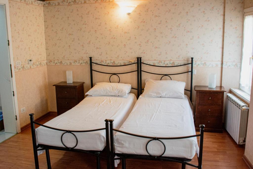 Postel nebo postele na pokoji v ubytování Hotel Capitelli