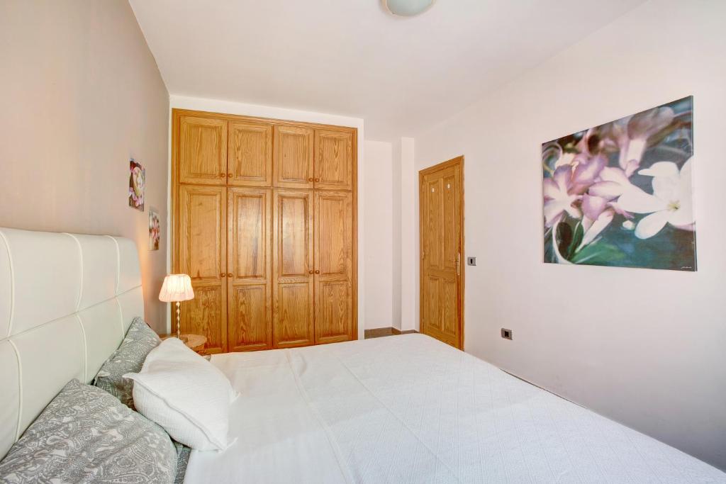 A bed or beds in a room at Casa Playa