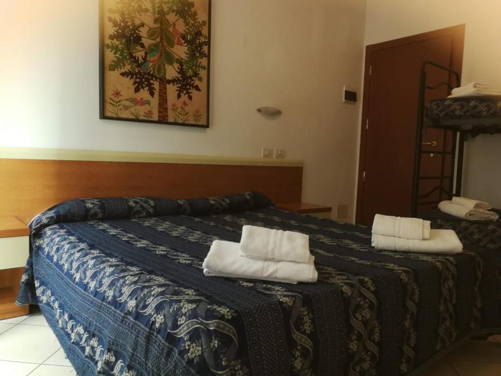 Postel nebo postele na pokoji v ubytování Hotel Jana
