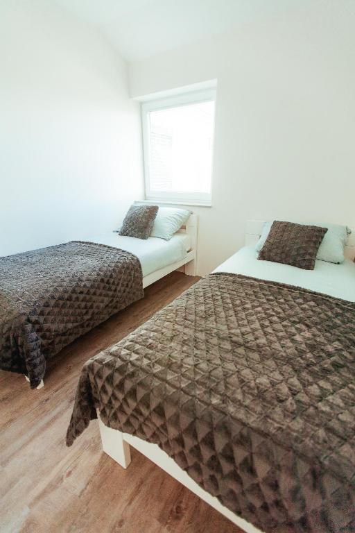 Postel nebo postele na pokoji v ubytování Sunny Oak Estate