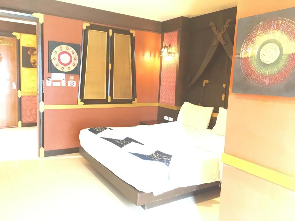 Postel nebo postele na pokoji v ubytování 99 Residence