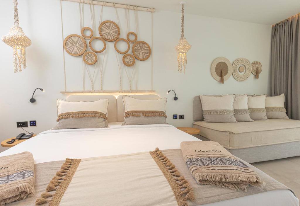 Postel nebo postele na pokoji v ubytování Cabana Blu Hotel & Suites