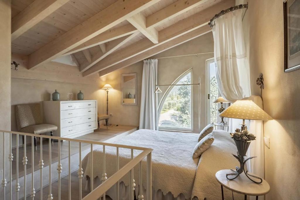 Postel nebo postele na pokoji v ubytování Guadalupe Tuscany Resort