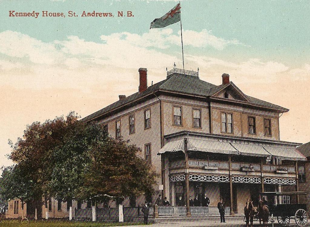 an old picture of a building with a flag on it at Kennedy House in Saint Andrews