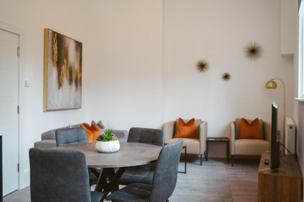 a living room with a table and chairs and a couch at Apartment 7 1 bedroom, sleeps x 4 in York