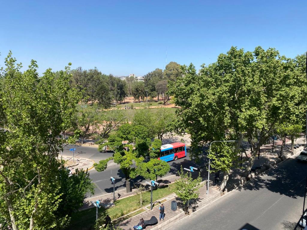 an aerial view of a bus in a parking lot at G3 Inn apartments in Mendoza