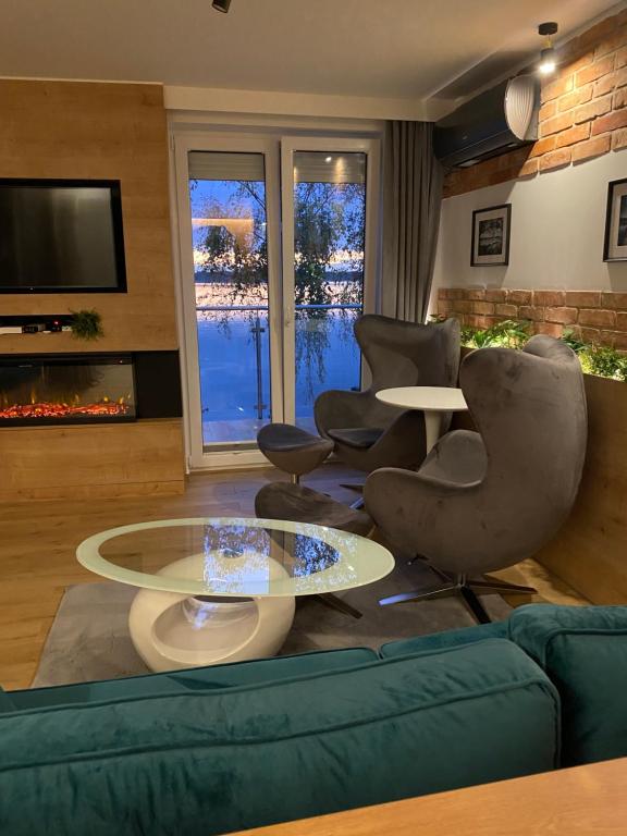 Posedenie v ubytovaní Apartament MoLoo III