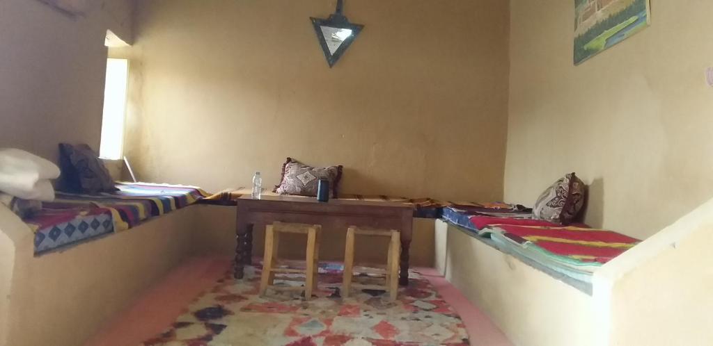Postel nebo postele na pokoji v ubytování Auberge Camping La Khaima