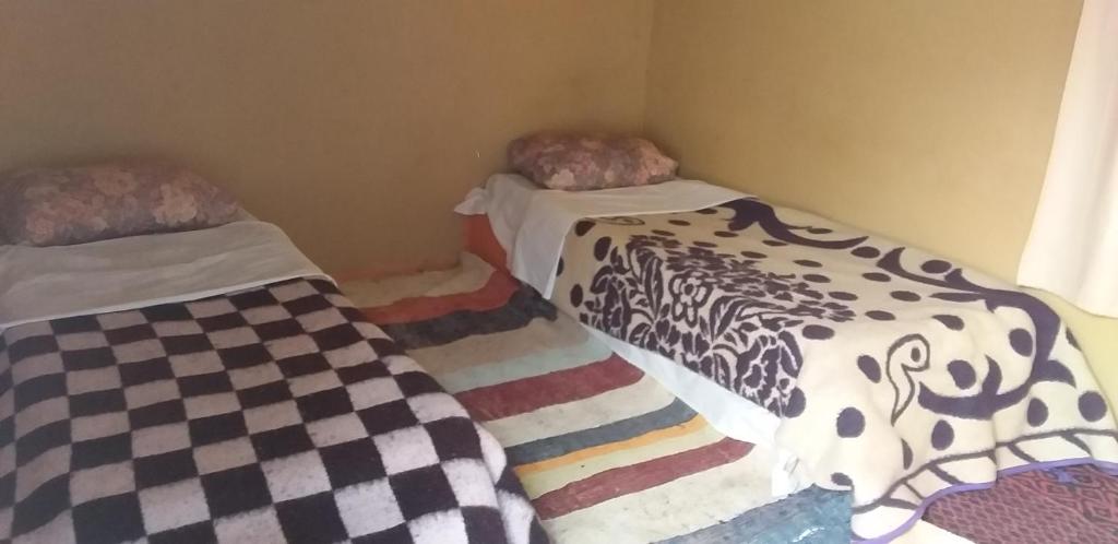 Postel nebo postele na pokoji v ubytování Auberge Camping La Khaima