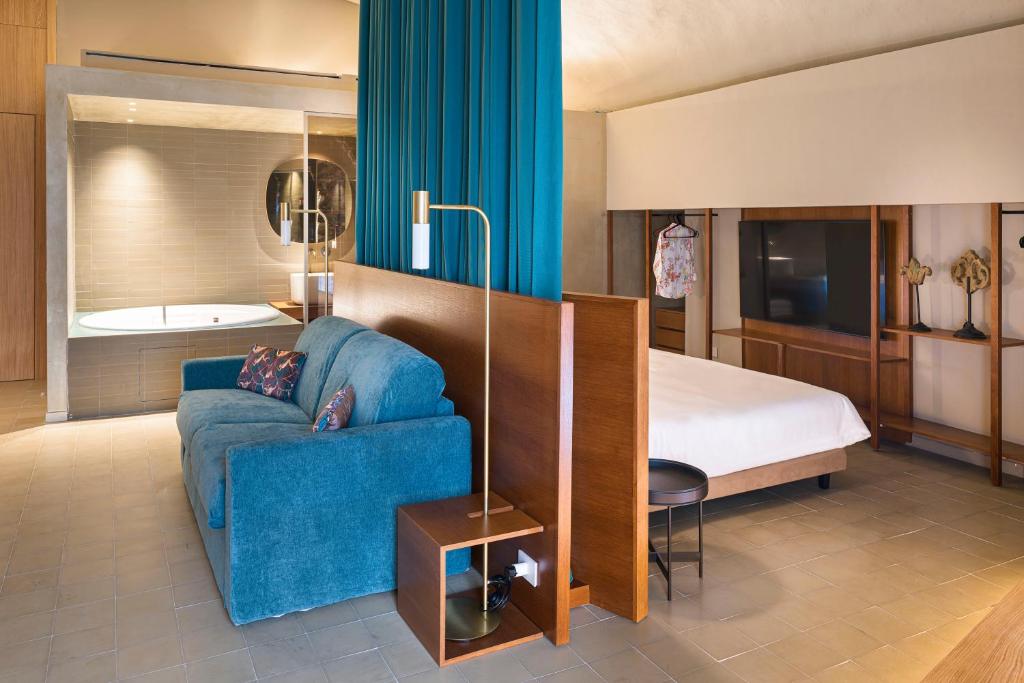 Postel nebo postele na pokoji v ubytování BASTIÒ PRIVATE SUITES