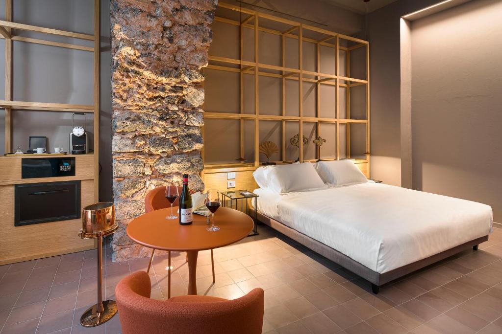 Postel nebo postele na pokoji v ubytování BASTIÒ PRIVATE SUITES