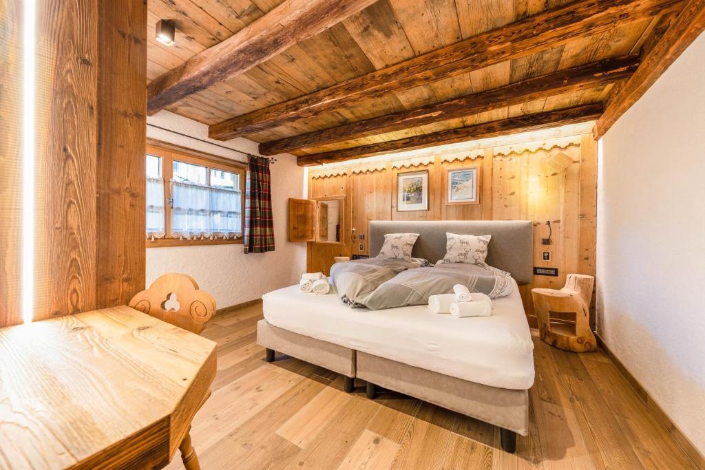 Posteľ alebo postele v izbe v ubytovaní Chalet Catinaccio Rosengarten 18