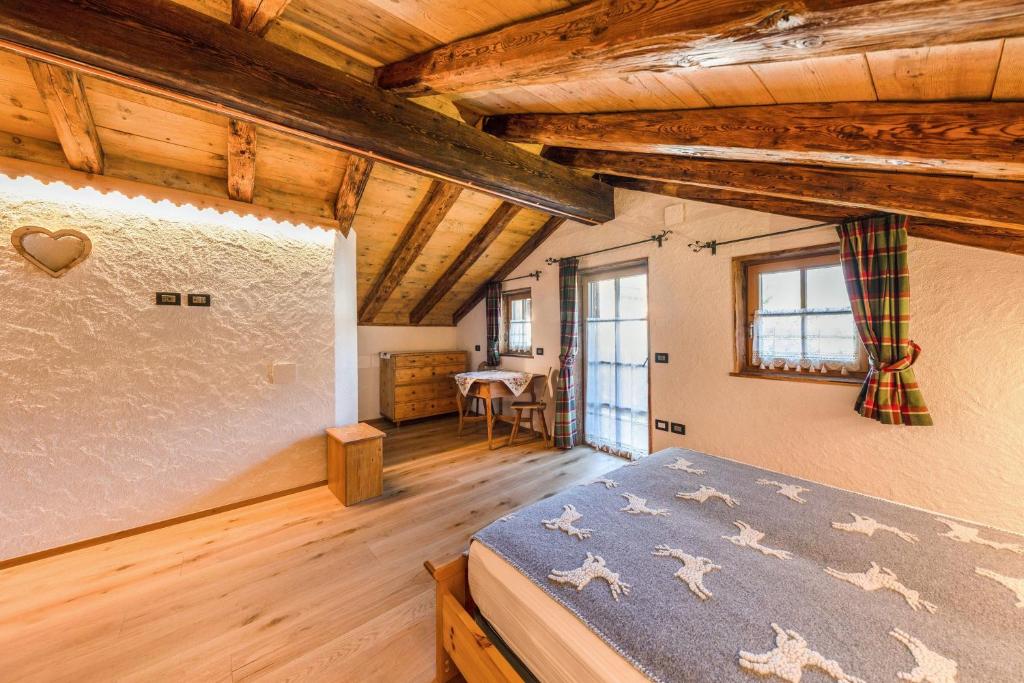 Posteľ alebo postele v izbe v ubytovaní Chalet Catinaccio Rosengarten 18