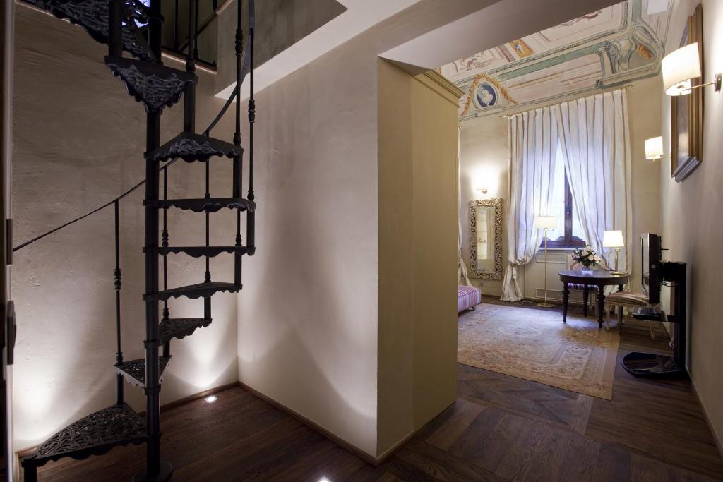 Postel nebo postele na pokoji v ubytování Palazzo Carletti