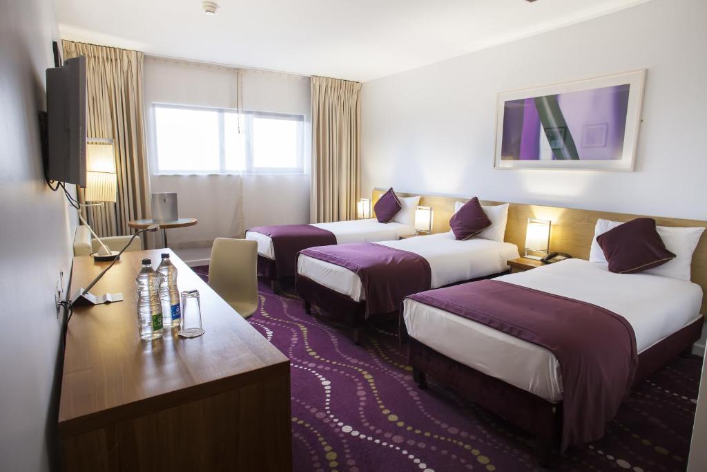 Postel nebo postele na pokoji v ubytování Louis Fitzgerald Hotel