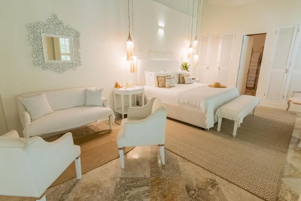 Postel nebo postele na pokoji v ubytování Casa Diluca Cartagena Hotel Boutique
