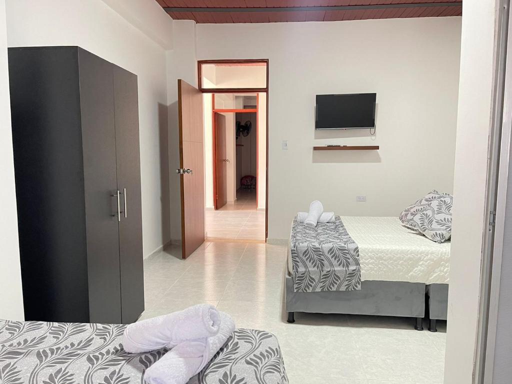 Postel nebo postele na pokoji v ubytování Casa Hotel Estelar