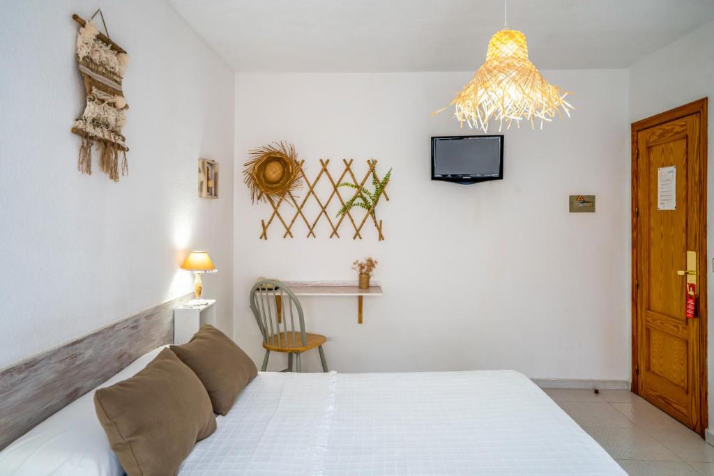 Postel nebo postele na pokoji v ubytování LOS NAREJOS Hotel