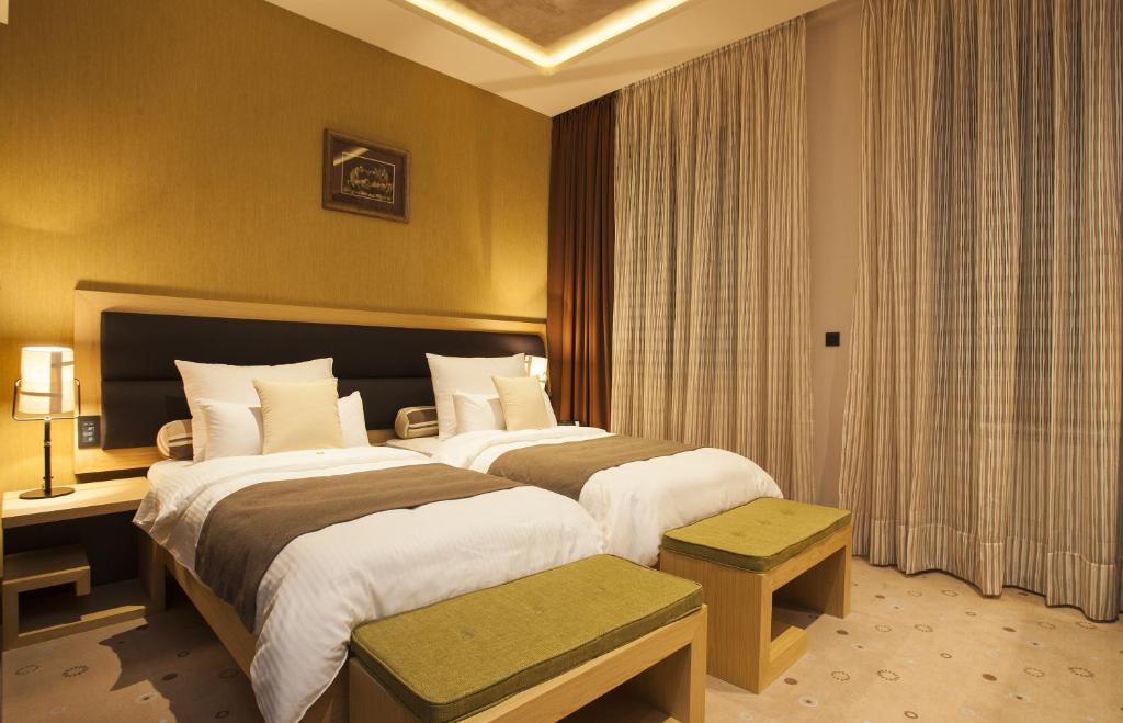 Postel nebo postele na pokoji v ubytování Atera Business Suites
