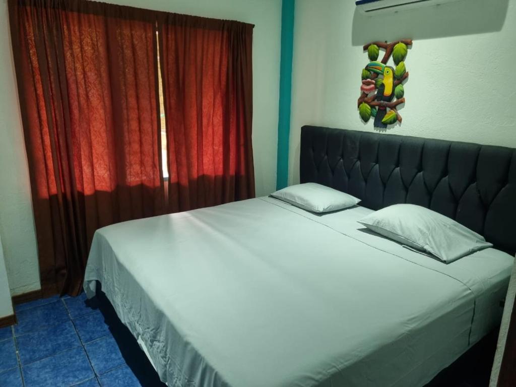 Cama ou camas em um quarto em Cristina - Hotel Familiar