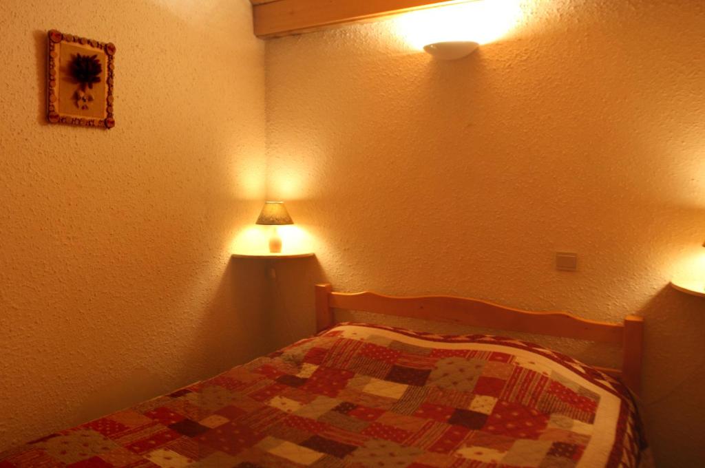 Postel nebo postele na pokoji v ubytování Hotel Les Lans
