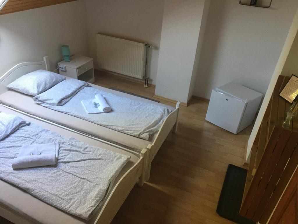 Posteľ alebo postele v izbe v ubytovaní Napsütötte Kehida