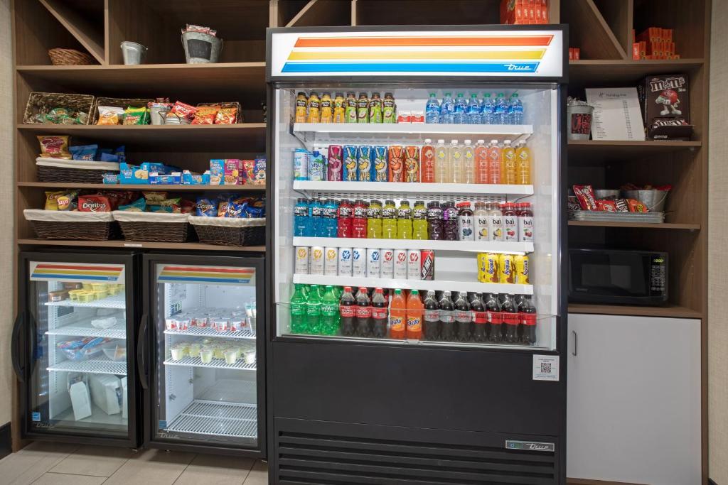 a refrigerator filled with lots of different types of drinks at Holiday Inn & Suites Durango Downtown by IHG in Durango