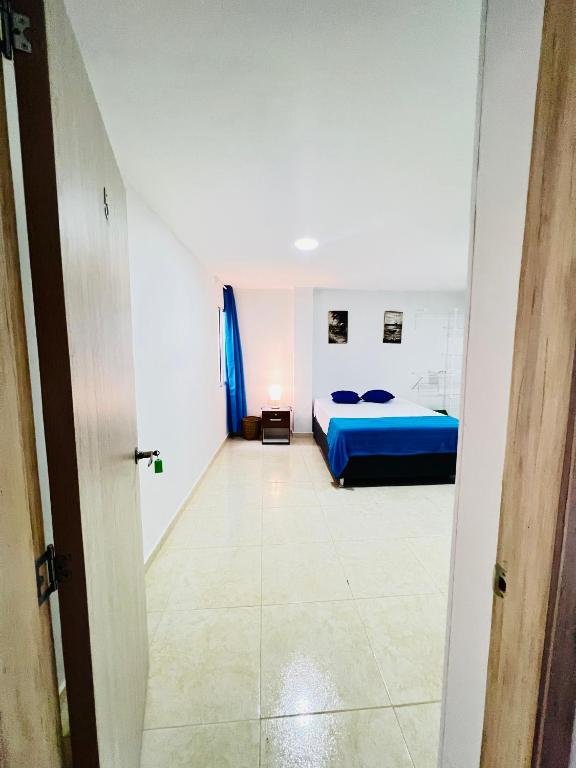Postel nebo postele na pokoji v ubytování Hotel Taganga Plaza Santa Marta