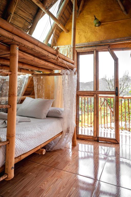 Postel nebo postele na pokoji v ubytování Chalet Ecoturismo La Nohelia
