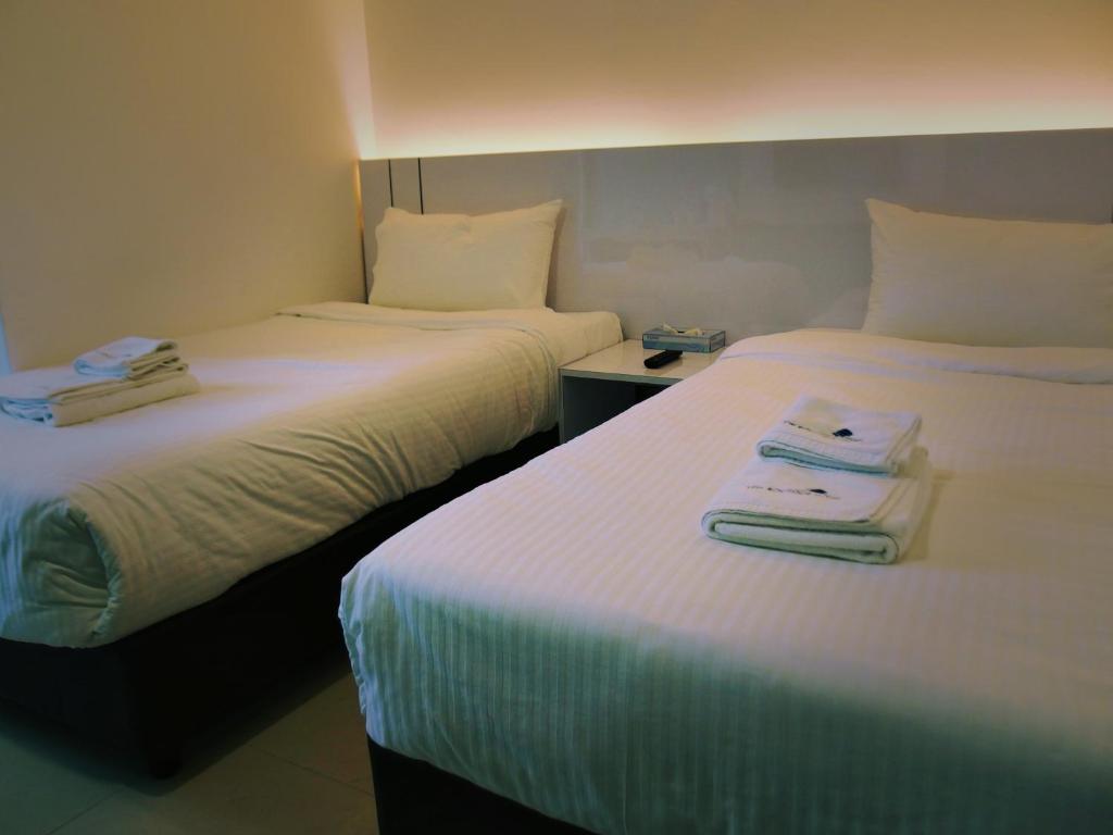 Postel nebo postele na pokoji v ubytování Yew Boutique Hotel
