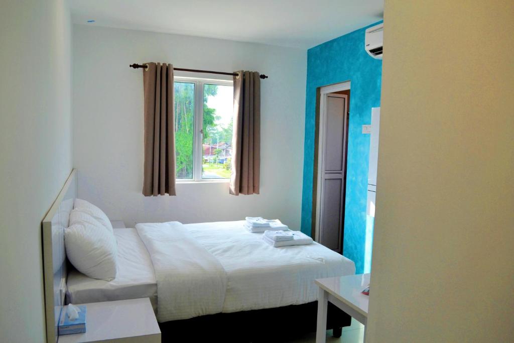 Postel nebo postele na pokoji v ubytování Yew Boutique Hotel