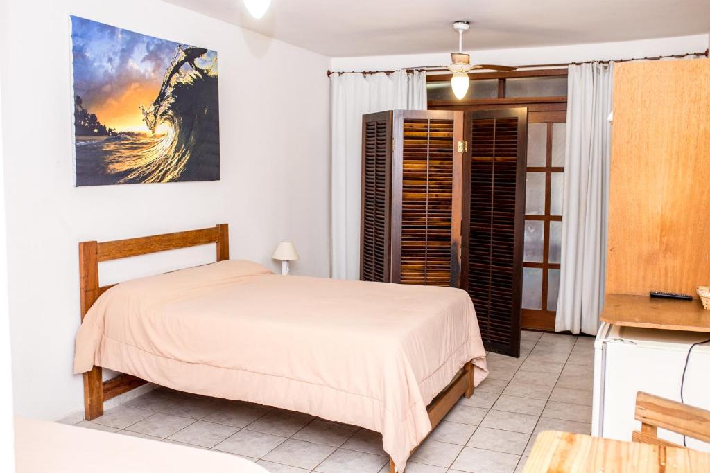 A bed or beds in a room at Vila Juquehy Lofts & Suítes