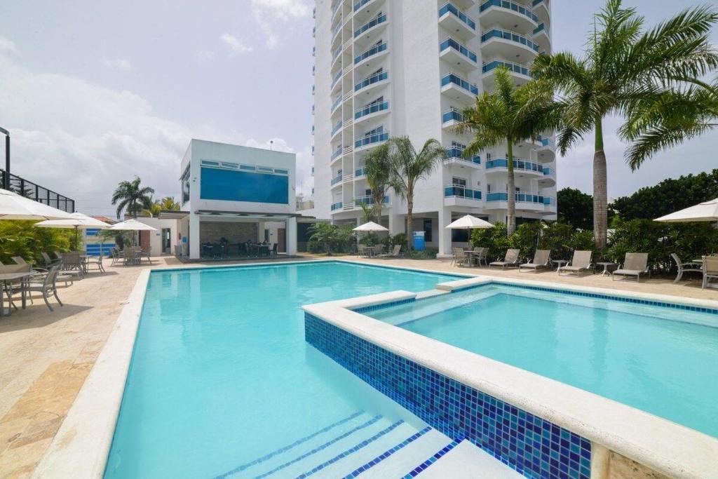 Bazén v ubytování Elegante Aqua Marine Apartamento Juan Dolio nebo v jeho okolí